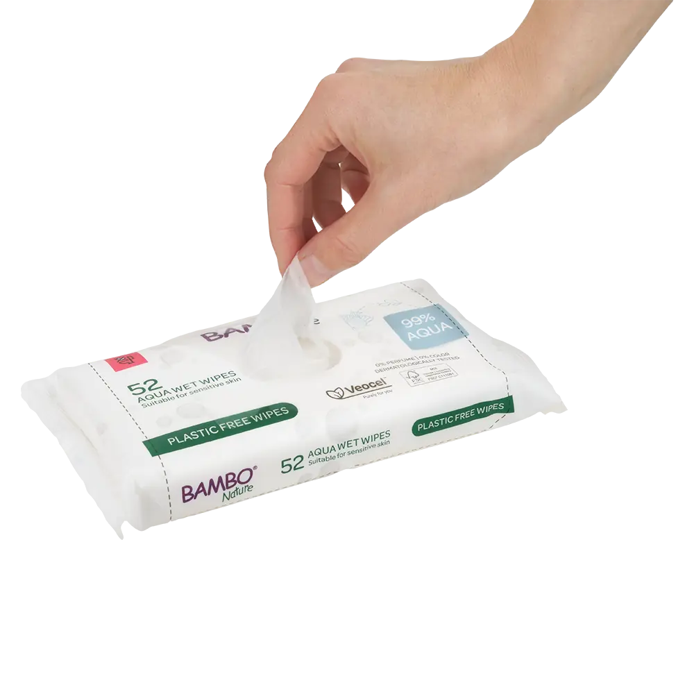 Hand pulling a Bambo Nature 99% Aqua wet wipe from the pack