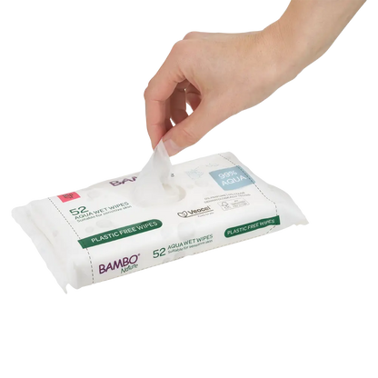Hand pulling a Bambo Nature 99% Aqua wet wipe from the pack